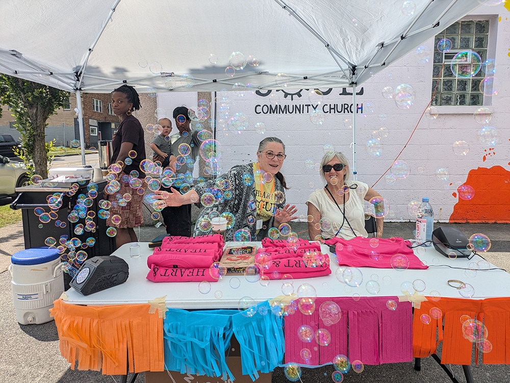 Children's Ministry greeters with smiles and bubbles